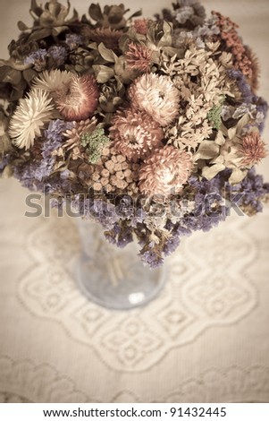 A bouquet of dried flowers in a vase