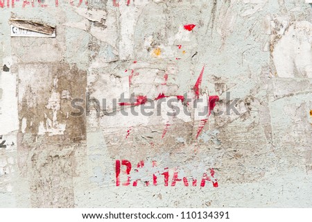 Old textured abandoned wall with ads