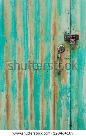 Texture of old rust painted door with lock