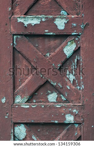 Abandoned painted wooden door