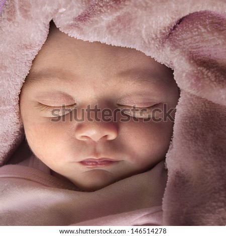 Baby sleeping - baby face in a good and peaceful sleep in a square format composition