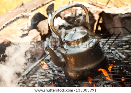 Kettle with water heated on the fire