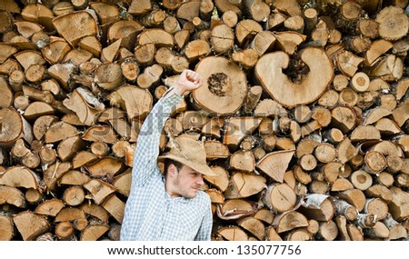Woodcutter with straw hat fist in the air - acomplishment