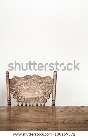Wooden Dining room table and chair details and blank wall for your text, image or logo.
