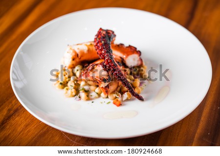 Cooked Octopus Plate with Chickpeas in a Portuguese Restaurant