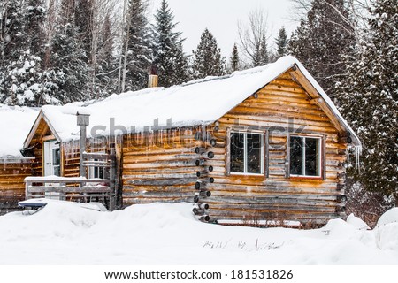 Log Wood Chalet in Quebec, Canada during a cold winter day.
