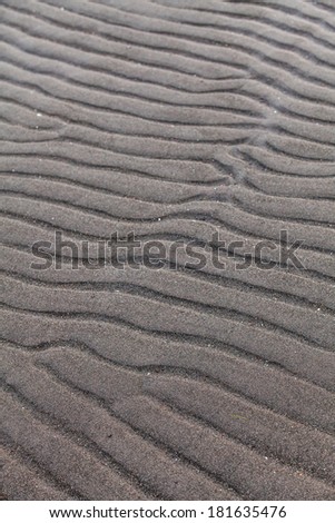 Details and Line in the Sand texture of a Beach created by the Low Tide