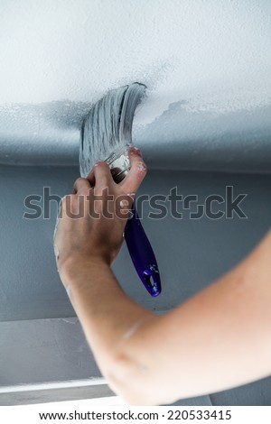 Painting the Edges of the Ceiling with Paintbrush