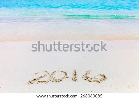 Will you Travel in 2016 ? New Year Numbers Written down on the Beach