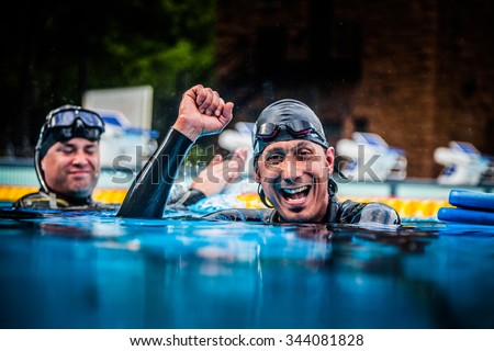Montreal, CANADA - May 30th, 2015. Official AIDA Freediving Pool Competition Taking place in the Parc Jean-Drapeau Olympic Pool. Happy Freediver Celebrating the Succes of his First Place and record.