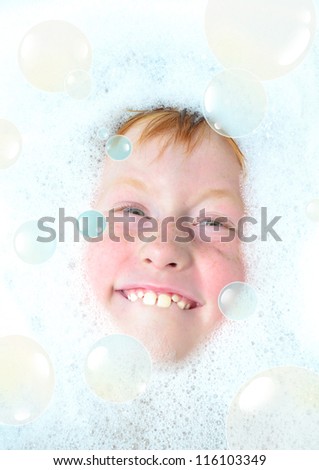 Portrait of a funny kid playing the ape a foam
