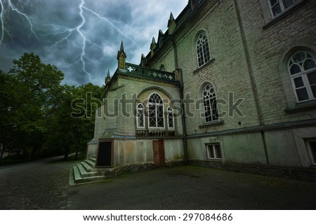 Ancient mystical sinister house during a thunderstorm