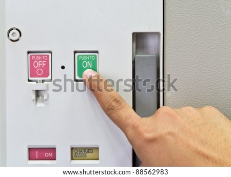 Finger to press button to start  air circuit breaker