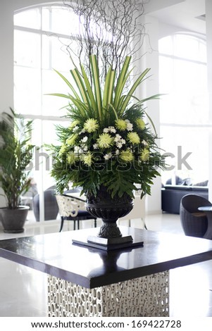 Beautiful white and green flower arrangement in elegant foyer