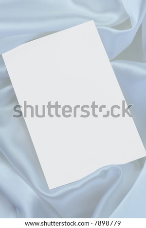 White blank card on white satin