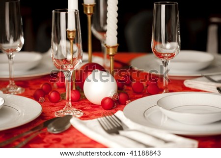 stock photo Red and white Christmas table setting shallow depth of field
