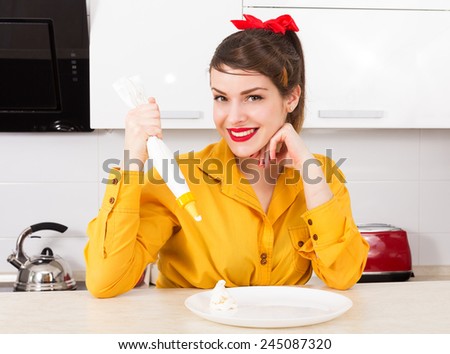Stylish pin up housewife in her kitchen