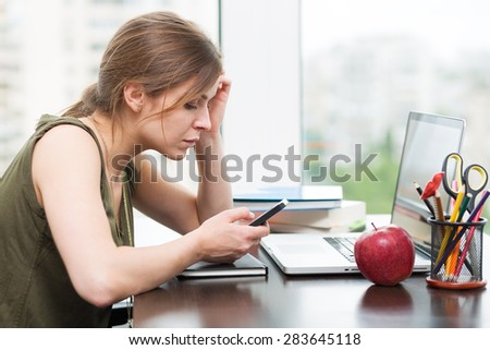 Beautiful student girl working at the computer