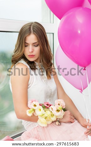 Romantic girl with flowers and balloon