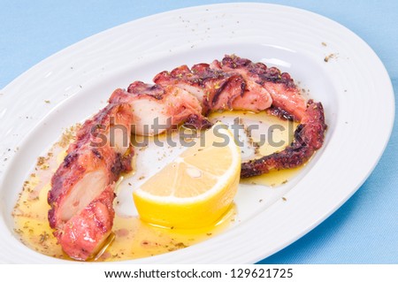 Grilled octopus with lemon sauce.