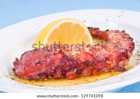 Grilled octopus with lemon sauce.