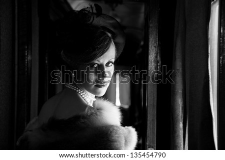Retro Woman in hat with veil and fox furs