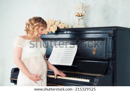 Expectant mother in anticipation of birth of baby. Music of Heart