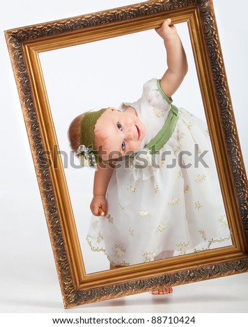 Portrait of girl with picture frame