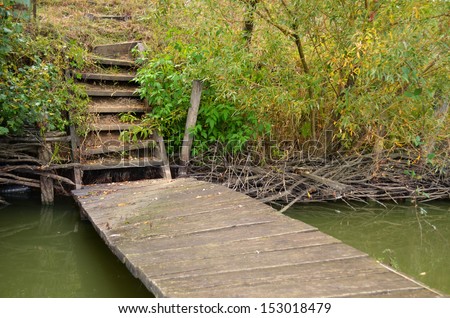 Old wood stairs on lake