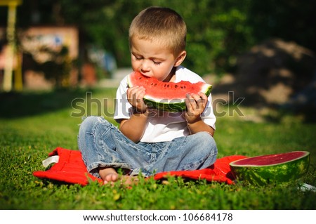 Young blond boy has healthy eating habits