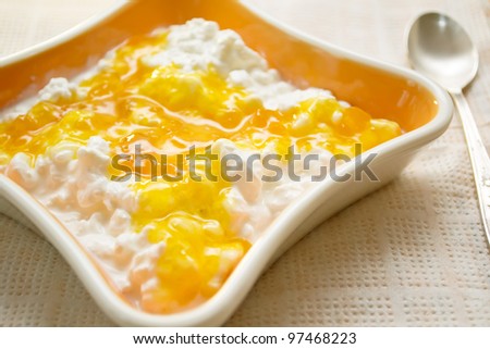 cottage cheese with jam in the orange bowl