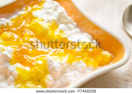 cottage cheese with jam in the orange bowl