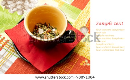 Black tea cup on the table cloth color