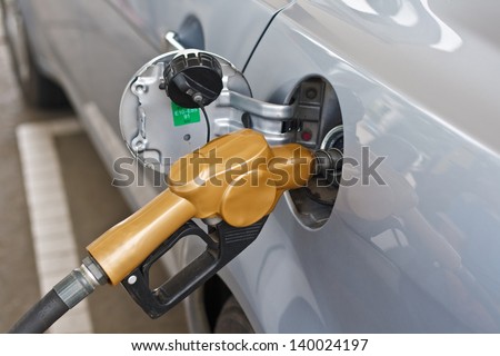 Refueling vehicles in petrol station to the car.