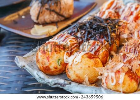 Japan food : Grilled dough to a circle stuffed squid in restaurant.