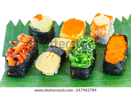 Sushi : Rice wrap seaweed on squid and japan seaweed, Rice and sweet egg on isolated background.