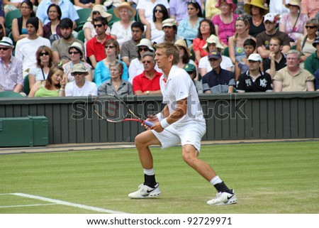 LONDON - JUNE 24: Jarkko Nieminen of Finland returns ball during second round match against Andy Murray of Scotland at Wimbledon in London, England on June 24, 2010