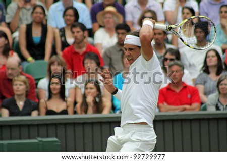 LONDON - JUNE 24: Rafael Nadal of Spain returns ball during second round match against Robin Haase of the Netherlands at Wimbledon in London, England on June 24, 2010