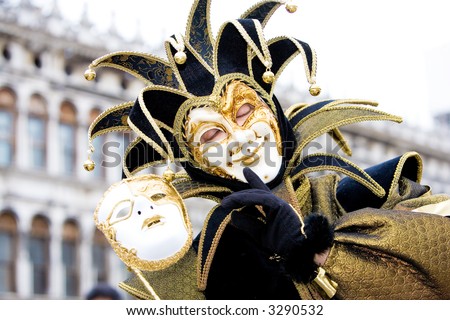 A joker with his mask at the Venice carnival