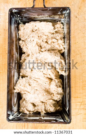 Dough in a baking tin ready for baking