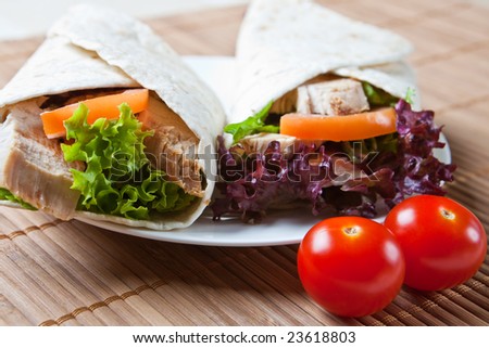 Turkey, salad, and stuffing wraps with tomatoes