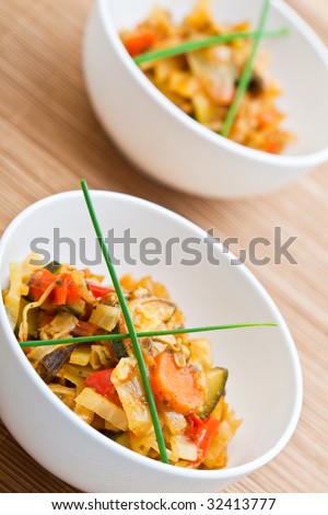 Hot vegetable stir fry in a white bowl