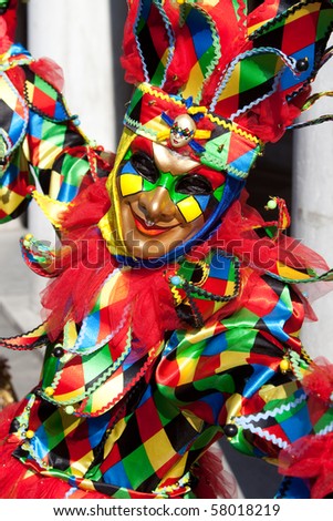 Portrait of a Joker in costume at the Venice Carnival, Italy.