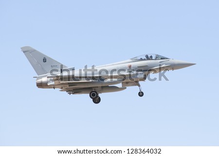 ALBACETE,SPAIN - APRIL 11: Military fighter jet during demonstration in Albacete air base, Los Llanos, Aerobatic Spanish patrol perform at an airshow (TLP) on April 11, 2012 in Albacete,Spain