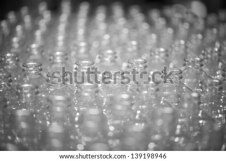 Rows of empty water bottles at bottling plant