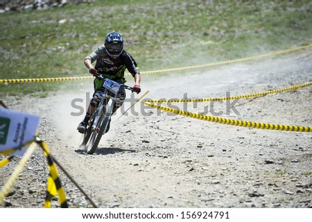 GRANADA, SPAIN - JUNE 30: Unknown racer on the competition of the mountain downhill bike \