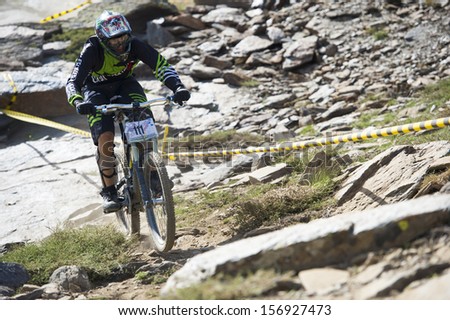 GRANADA, SPAIN - JUNE 30: Unknown racer on the competition of the mountain downhill bike \