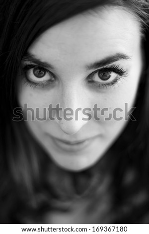 Portrait face of real beautiful woman. Image on black and white.