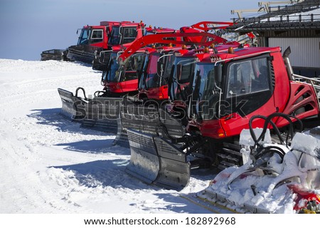 Group of Snow-grooming machine on snow hill ready for skiing slope preparations in Sierra Nevada, Granada.