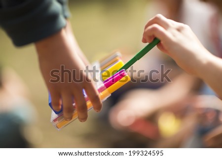 Children using a pencil case. Marker.